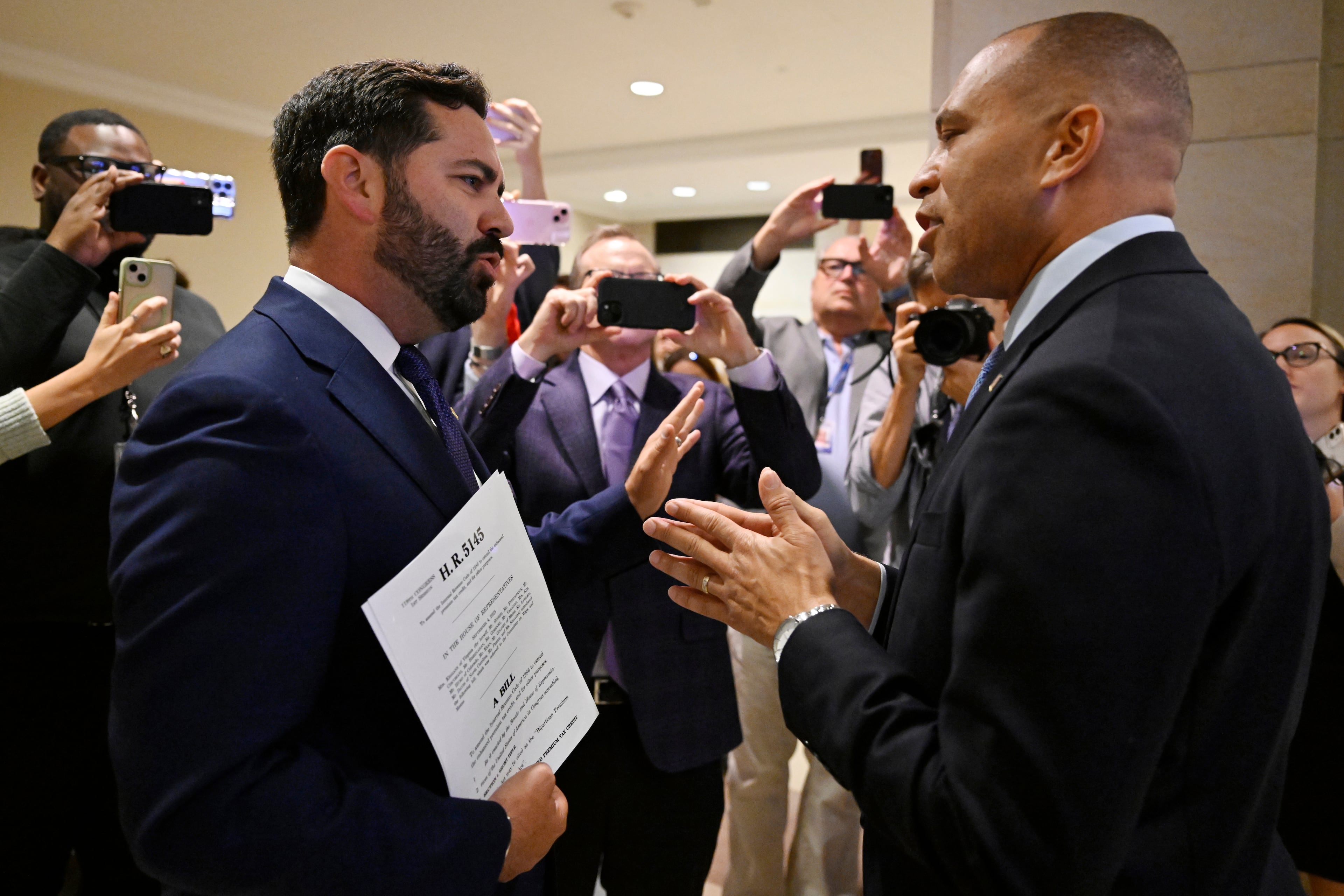 U.S. Rep. Michael Lawler, R-N.Y. (left) and House Minority Leader Hakeem Jeffries, D-N.Y., engaged in a heated discussion over the government shutdown on Wednesday in Washington.