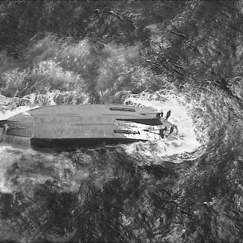 A U.S. Coast Guard HC-130 Hercules airplane crew assigned to Coast Guard Air Station Barbers Point flies over an overturned vessel offshore Saipan, Saturday, April 18, 2026, while searching for a missing vessel, the Mariana, that experienced an engine failure April 15. (U.S. Coast Guard/Air Station Barbers Point via AP)