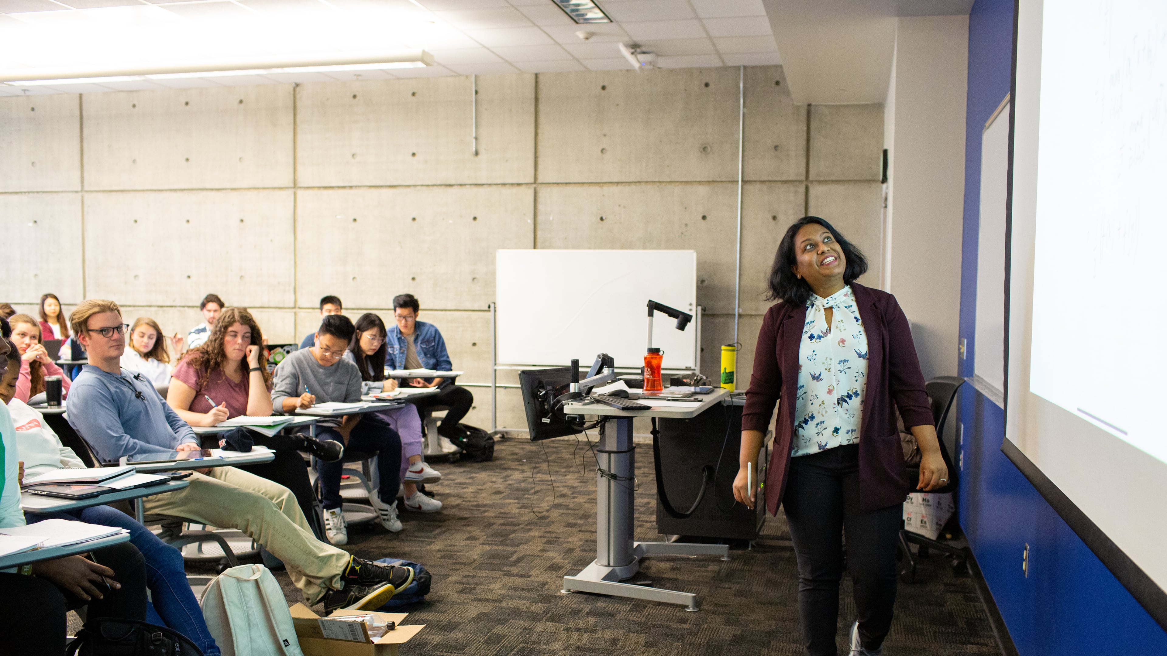Georgia Tech assistant professor Swati Gupta goes over a practice exam during class in Atlanta. A Georgia-specific survey released by the American Association of University Professors this month found that more than half of 800 professors surveyed in the state would not recommend Georgia to a colleague. (Rebecca Wright for the AJC 2019)