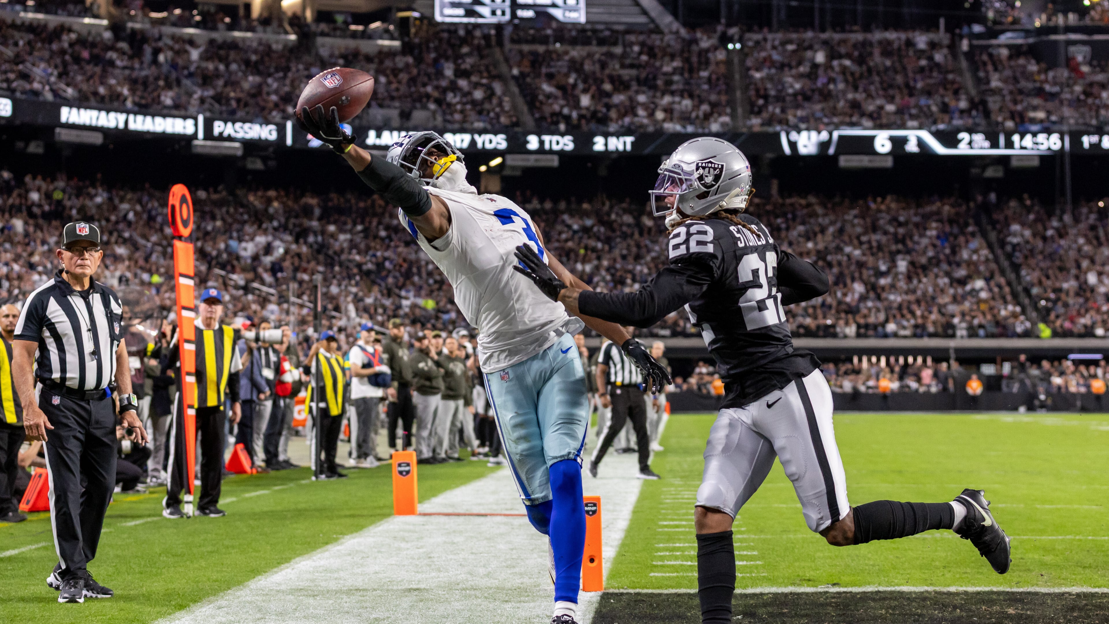 Cowboys wide receiver George Pickens (left) tries to catch a pass with one hand against the Raiders on Monday, Nov. 17, 2025, in Las Vegas. Pickens could not come down with the touchdown catch, but he had nine receptions for 144 yards and a TD in the win over Las Vegas. (Jeff Lewis/AP)