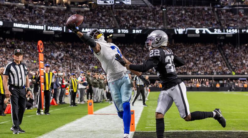 Cowboys wide receiver George Pickens (left) tries to catch a pass with one hand against the Raiders on Monday, Nov. 17, 2025, in Las Vegas. Pickens could not come down with the touchdown catch, but he had nine receptions for 144 yards and a TD in the win over Las Vegas. (Jeff Lewis/AP)