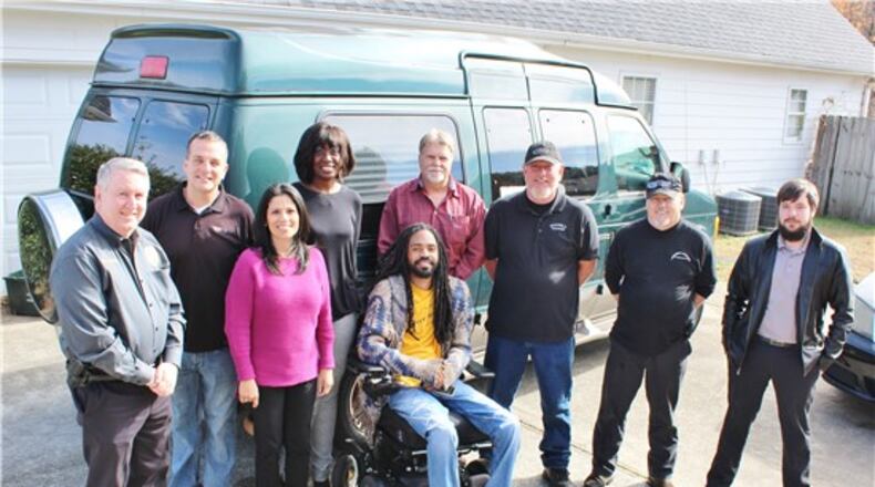 From left, Snellville Police Chief Roy Whitehead; Jamey Towler, Tire Dock; Sabrina Nizam, assistant district attorney, Gwinnett Judicial Circuit; Andrea Alabi, assistant district attorney, Gwinnett Judicial Circuit; Que Crane; Howard Sims, Brooks Towing; John Soesbe and Richard Jewell, Soesbe’s Garage; and Greg Smith, AutoZone. SPECIAL PHOTO / CITY OF SNELLVILLE