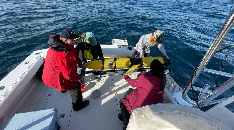 Researchers from the UGA Skidaway Institute and the University of South Carolina deploy a Teledyne G3 Slocum Glider in January 2023. (Photo Courtesy of the Catherine Edwards Lab)