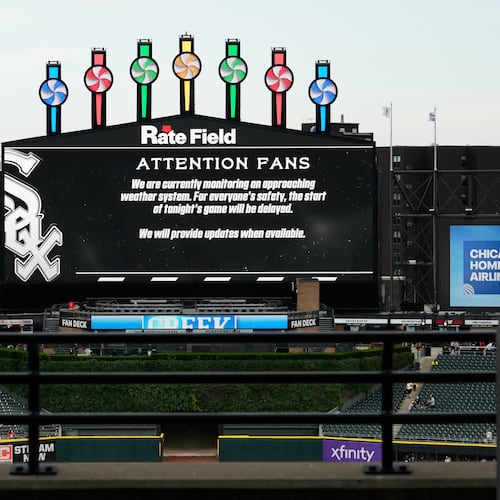 Information about rain delay displays on the big screen during a rain delay before a baseball game between the Atlanta Braves and the Chicago White Sox in Chicago, Thursday, June 11, 2026. (Nam Y. Huh/AP)