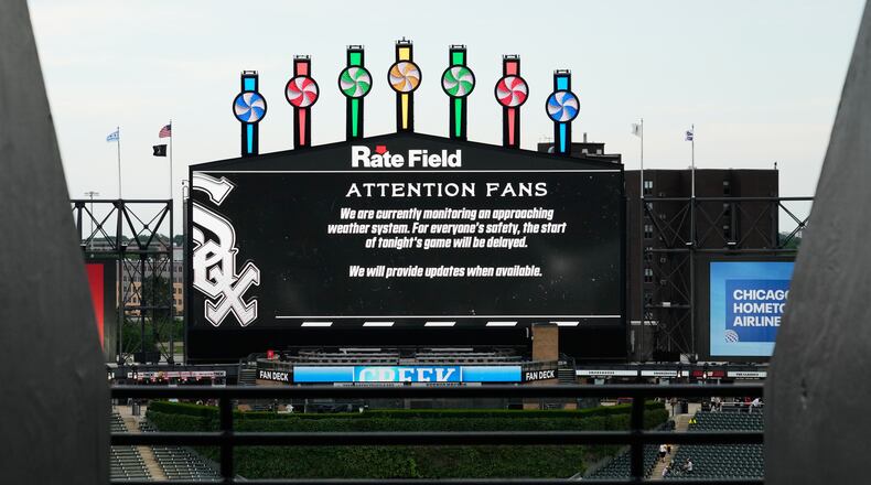 Information about rain delay displays on the big screen during a rain delay before a baseball game between the Atlanta Braves and the Chicago White Sox in Chicago, Thursday, June 11, 2026. (Nam Y. Huh/AP)