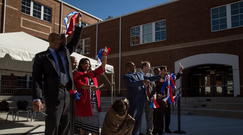 Dignitaries cut the ribbon during the ribbon-cutting ceremony at the Barack H. Obama Elementary Magnet School of Technology on Thursday, February 16, 2017. The school It’s the first Georgia school named after the 44th president. STEVE SCHAEFER / SPECIAL TO THE AJC