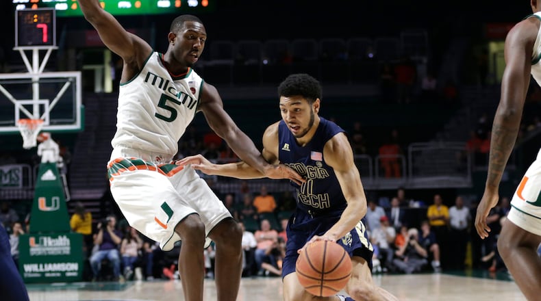Georgia Tech’s Josh Heath (11) drives to the basket as Miami’s Davon Reed (5) defends during the first half of an NCAA college basketball game, Wednesday, Feb. 15, 2017, in Coral Gables, Fla. (AP Photo/Lynne Sladky)
