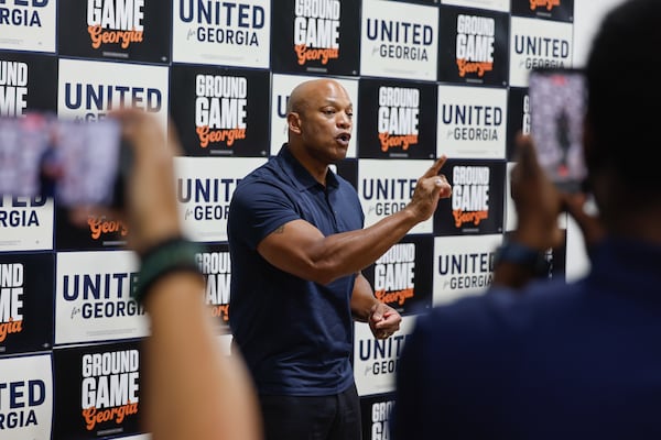 Maryland Gov. Wes Moore speaks at a rally at a Democratic field office in East Point on Tuesday. (Arvin Temkar/AJC)
