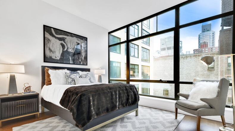 The use of black furniture is a bold but elegant choice in this bedroom. (Design Recipes/TNS)