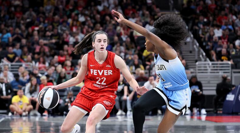 Caitlin Clark #22 of the Indiana Fever dribbles against Dana Evans #11 of the Chicago Sky during the first quarter in the game at Gainbridge Fieldhouse on June 1, 2024, in Indianapolis, Indiana. (Andy Lyons/Getty Images/TNS)