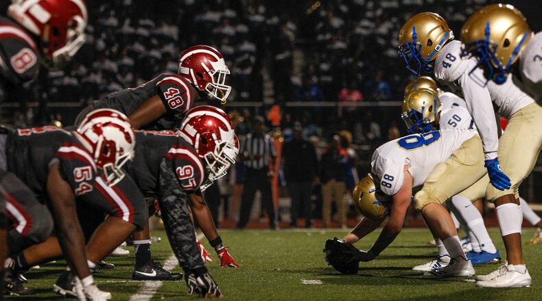 Hillgrove and McEachern players line up during the first half of a high school football game between the McEachern Indians and the Hillgrove Hawks at Hillgrove High School in Powder Springs, Georgia, on Friday, Nov. 3, 2017. (CASEY SYKES, CASEY.SYKES@AJC.COM)