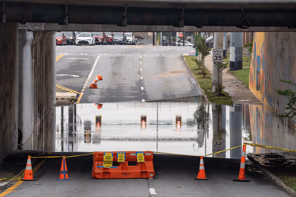 The southbound side of Northside Drive near Whitehall Street in Atlanta was closed the morning of Thursday, May 21, 2026, because of standing water following Wednesday’s rain showers. North Georgia will see more rain in the coming days, possibly causing more flooding. (Ben Hendren for the AJC)