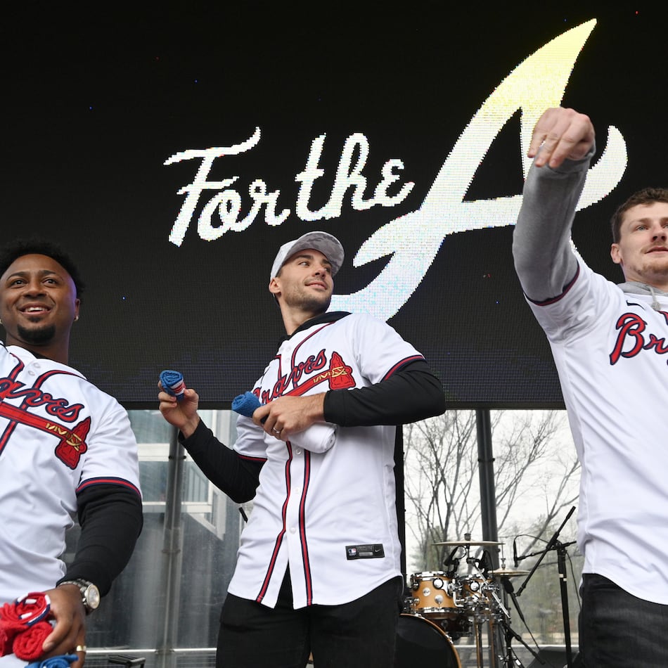Atlanta Braves (from left) second baseman Ozzie Albies, first baseman Matt Olson and catcher Sean Murphy throw free t-shirts to fans at Georgia Power Pavilion Stage during Braves Fest Opening Rally at The Battery Atlanta, Saturday, January 27, 2024, in Atlanta. (Hyosub Shin/AJC)