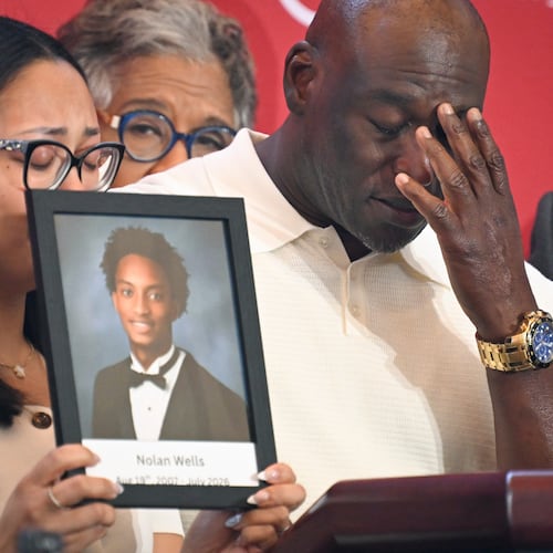 Elmore Wonsley, right, pauses from speaking as wife Christine Wonsley holds a photo of her deceased son, Nolan Wells, as they appear at the National Urban League's annual conference, Thursday, July 30, 2026, in Nashville, Tenn. (AP Photo/John Amis)
