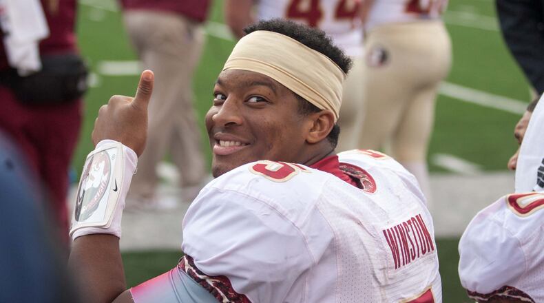 Nov 9, 2013; Winston-Salem, NC, USA; Florida State Seminoles quarterback Jameis Winston (5) smiles on the bench during the fourth quarter against the Wake Forest Demon Deacons at BB&T Field. Florida State defeated Wake Forest 59-3. Mandatory Credit: Jeremy Brevard-USA TODAY Sports