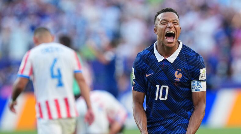 France's Kylian Mbappe (10) celebrates his team victory at the end of the World Cup round of 16 soccer match between Paraguay and France in Philadelphia, Saturday, July 4, 2026. (AP Photo/Martin Meissner)