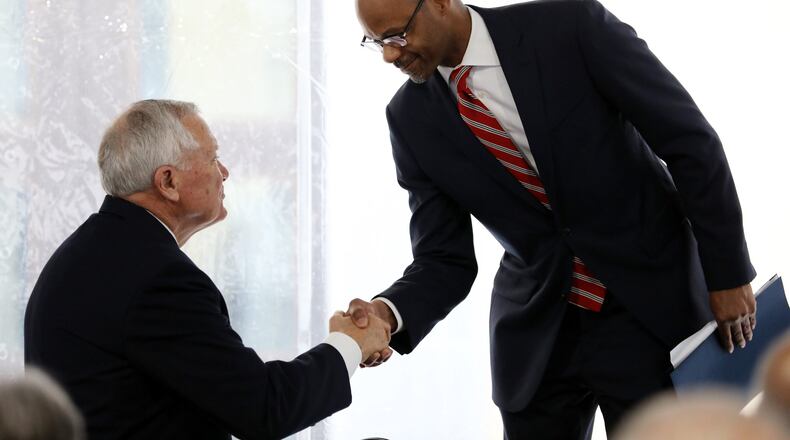Supreme Court of Georgia Justice Harold Melton (right) shakes the hand of former Georgia Gov. Nathan Deal on Tuesday, Feb. 11, 2020, during the dedication of the new Nathan Deal Judicial Center in Atlanta. (credit: Miguel Martinez for The Atlanta Journal-Constitution)