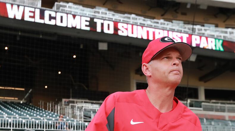 April 23, 2019 Atlanta: Georgia head baseball coach Scott Stricklin takes the field as he prepares his team to play Georgia Tech in the Spring Classic NCAA college baseball game at SunTrust Park on Tuesday, April 23, 2019, in Atlanta.    Curtis Compton/ccompton@ajc.com