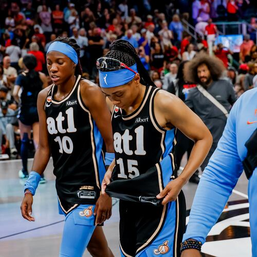 Atlanta Dream guard Allisha Gray (15) and guard Rhyne Howard (10) walks off the court after losing to the Indiana Fever in overtime of a WNBA game between the Atlanta Dream and the Indiana Fever, Sunday, Aug. 16, 2026, in Atlanta. (Erik S. Lesser for the AJC)