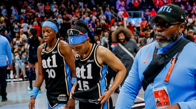 Atlanta Dream guard Allisha Gray (15) and guard Rhyne Howard (10) walks off the court after losing to the Indiana Fever in overtime of a WNBA game between the Atlanta Dream and the Indiana Fever, Sunday, Aug. 16, 2026, in Atlanta. (Erik S. Lesser for the AJC)