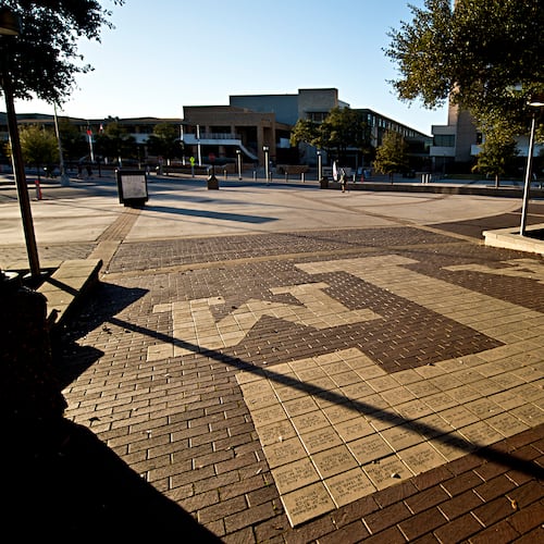 FILE - The sun sets over Texas A&M Campus, just outside Rudder Tower, Feb 12, 2016, in College Station, Texas. (Timothy Hurst/College Station Eagle via AP, File)