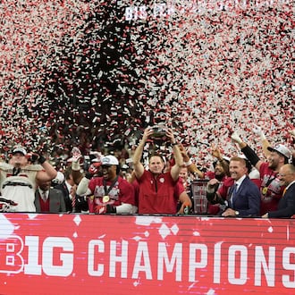 Indiana head coach Curt Cignetti holds the cahampionship trophy after the Big Ten championship NCAA college football game against Ohio State in Indianapolis, Saturday, Dec. 6, 2025. (AP Photo/Michael Conroy)