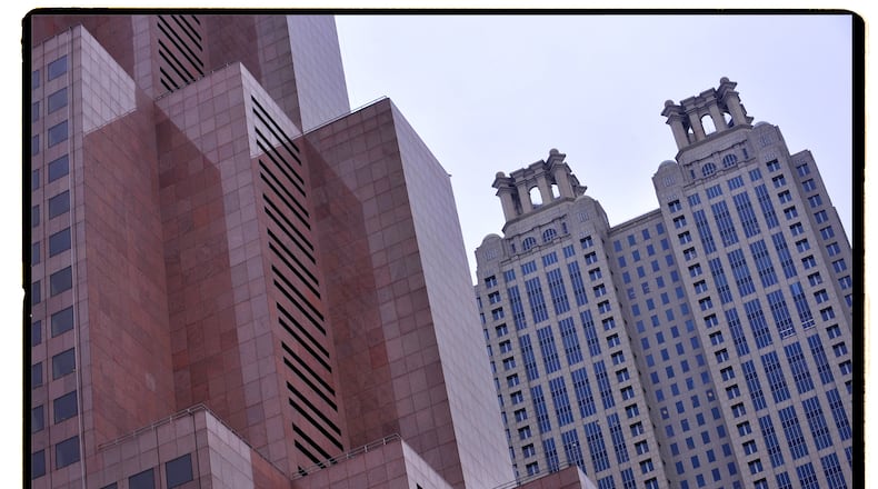 The 191 Peachtree Tower in downtown Atlanta, listed as city’s fourth tallest building, rises behind the Georgia-Pacific Center building. AJC File Photo