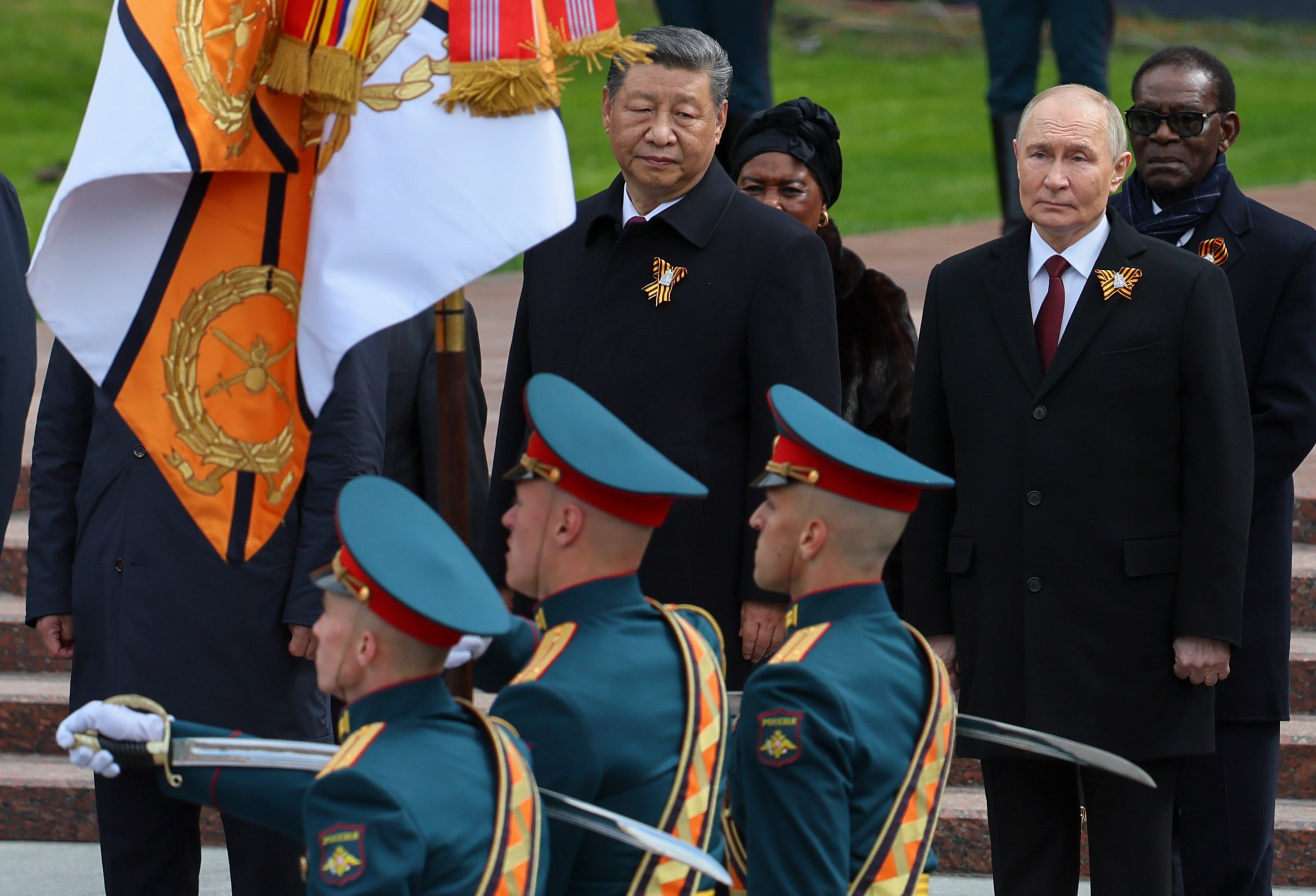 Chinese President Xi Jinping (left) and Russian President Vladimir Putin attend a wreath laying ceremony at the Tomb of the Unknown Soldier in Alexander Garden after the Victory Day military parade in Moscow in May. (Yuri Kochetkov/Pool Photo via AP)