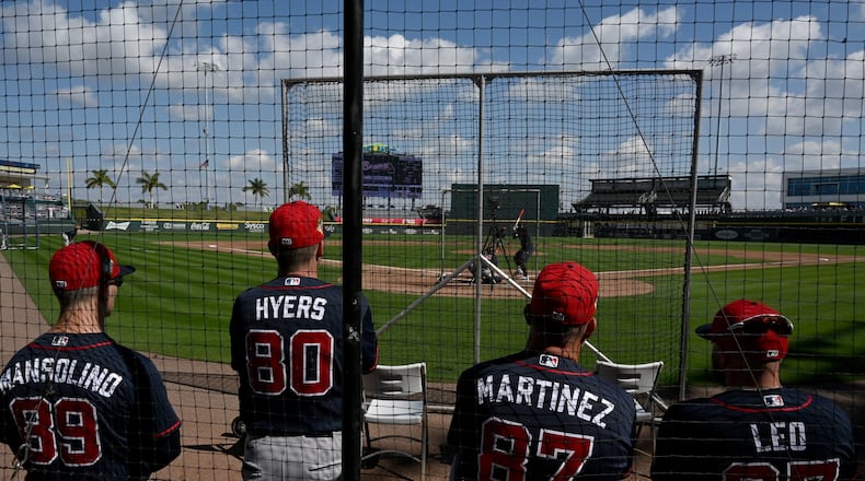 Atlanta Braves hitting coach Tim Hyers (second from left) and other coaching staff watch live batting practice session during spring training workouts at CoolToday Park, Saturday, Feb. 14, 2026, in North Port, Fla. (Hyosub Shin/AJC)