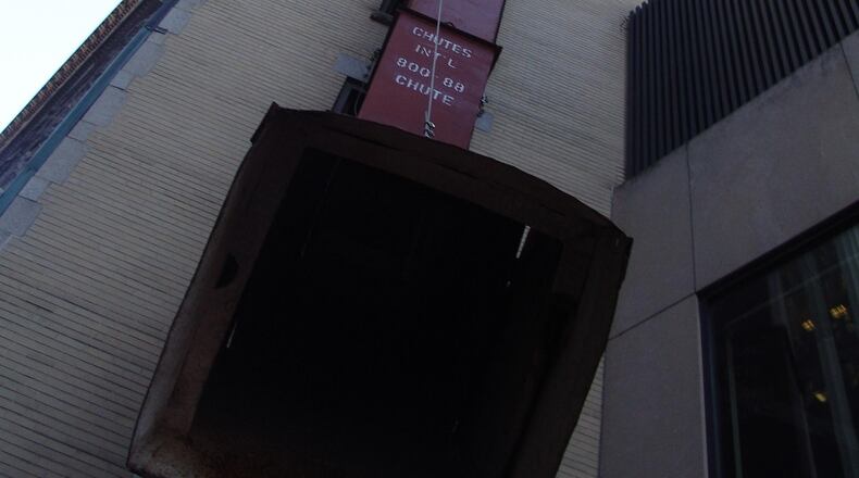 A Denver man was injured after he fell down a trash chute and into a trash compactor.