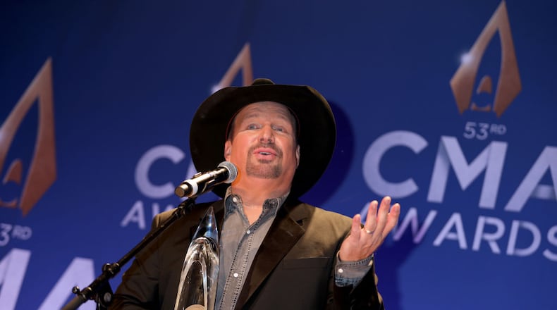 Garth Brooks poses with the CMA Award for Entertainer of the Year at the press room of the 53rd annual CMA Awards at the Bridgestone Arena on November 13, 2019 in Nashville, Tennessee. (Photo by Leah Puttkammer/Getty Images)
