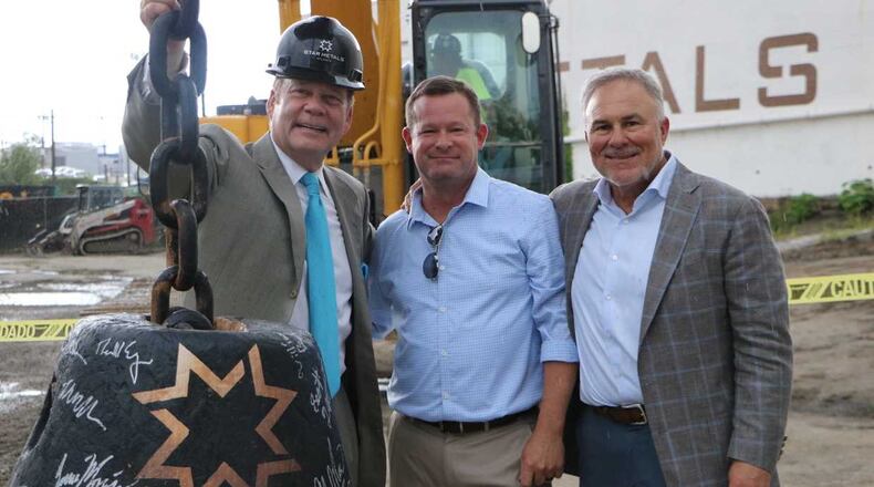 Allen Morris, left, Eric Kerley, center, and Les Juneau  attend a groundbreaking ceremony for Star Metals Residences on Aug. 9.