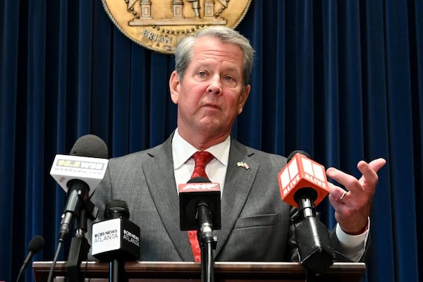 Gov. Brian Kemp speaks before signing the state’s new budget at the Georgia State Capitol on Tuesday, May 12, 2026, in Atlanta. Gov. Brian Kemp on Tuesday signed the state’s new budget – but not without deleting about $300 million of spending approved by the General Assembly just last month. (Hyosub Shin/AJC)