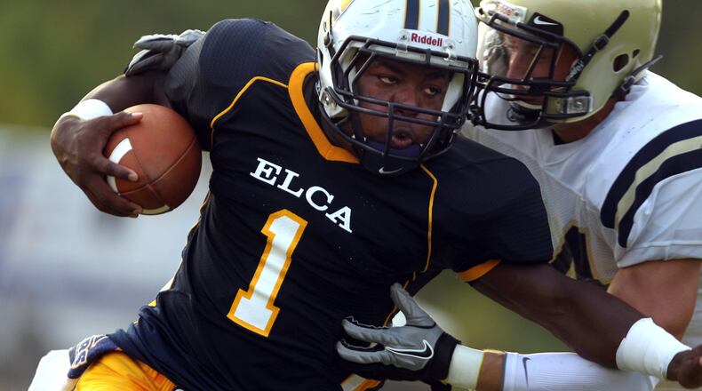 Eagle's Landing Christian Academy running back Keyante Green fights for yardage with a Briarwood Christian defender Aug. 26, 2011, in McDounough. (Jason Getz/AJC)