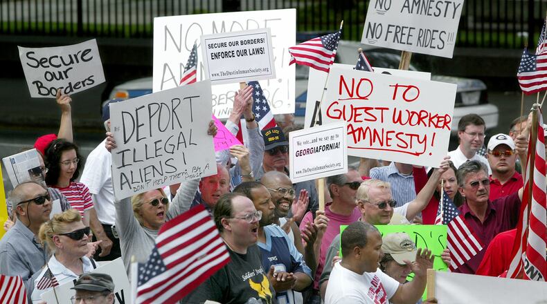 Protesters gathered at the Georgia Capitol in downtown Atlanta in April 2006 to call for legislation restricting unauthorized immigrants. (JOHN SPINK/AJC staff)