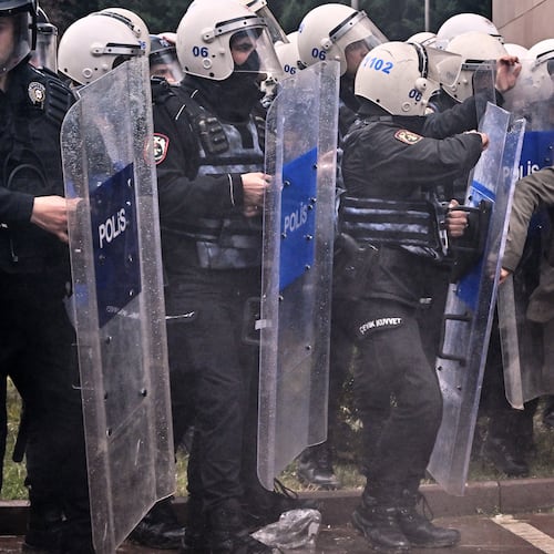 Police officers storm Turkey's main opposition Republican People's Party (CHP) headquarters to evict supporters gathered inside for party leader Ozgur Ozel, in Ankara, Sunday, May 24, 2026. (AP Photo/Ali Unal)