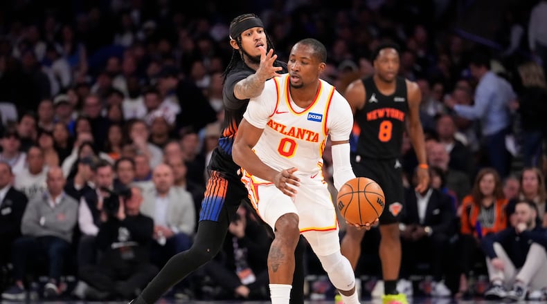 Hawks forward Jonathan Kuminga attempts to drive past Knicks guard Jordan Clarkson during the first half of Game 2 of a first-round playoff series April 20, 2026 in New York. He scored 19 points in the Hawks' victory. (Yuki Iwamura/AP)
