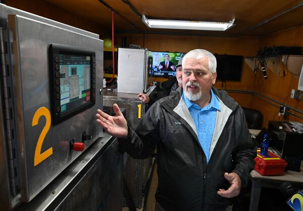 GDOT equipment manager Jeff Stone explains a brine maker during a media event to show the winter weather preparedness of the department's Forest Park maintenance facility Wednesday, Dec. 3, 2025. (Hyosub Shin/AJC)