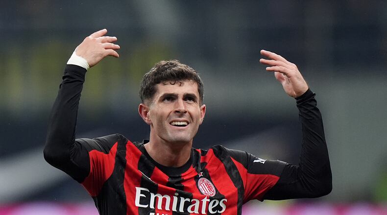 AC Milan's Christian Pulisic celebrates after scoring during the Serie A soccer match between Inter Milan and AC Milan in Milan, Italy, Sunday, Nov. 23, 2025. (Spada/LaPresse via AP)