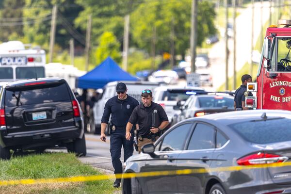 Law enforcement members respond to a shooting near Richmond Road Baptist Church in Lexington, Ky., Sunday, July 13, 2025. (Ryan C. Hermens/Lexington Herald-Leader via AP)
