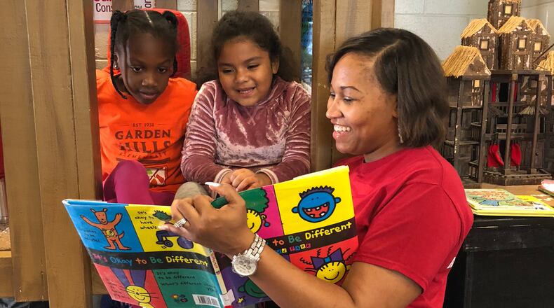 A volunteer with the nonprofit Everybody Wins! Atlanta reads to students. For 25 years, the organization has been dedicated to helping students who struggle with reading. Courtesy of Everybody Wins! Atlanta