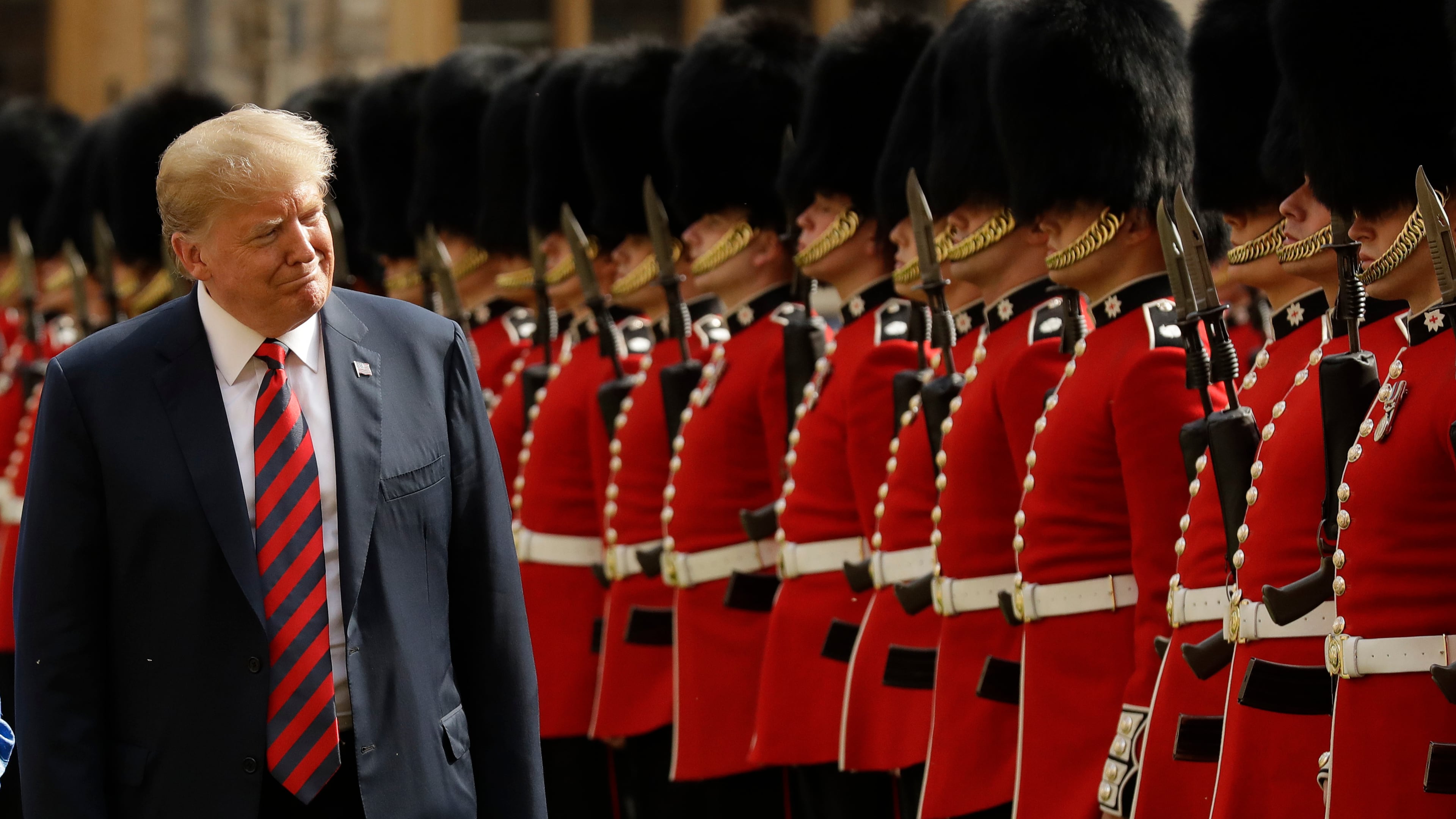 FILE - U.S. President Donald Trump inspects a Guard of Honour, formed of the Coldstream Guards at Windsor Castle in Windsor, England, Friday, July 13, 2018. (AP Photo/Matt Dunham, Pool, File)