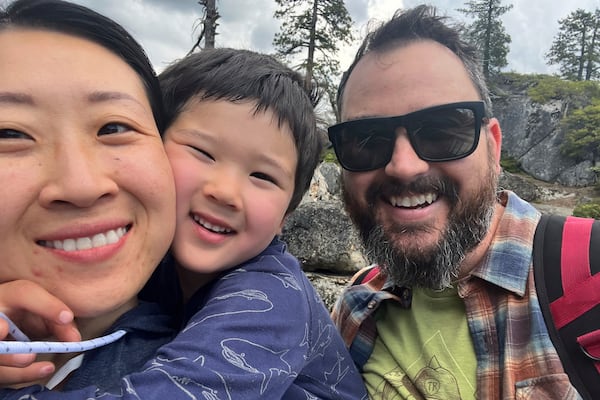 In this June 2023 photo provided by Phoebe Yu, she poses with her son Teddy Vucurevich, center, and husband Daniel Vucurevich in the Stanislaus National Forest near Sonora, Calif. (Phoebe Yu via AP)
