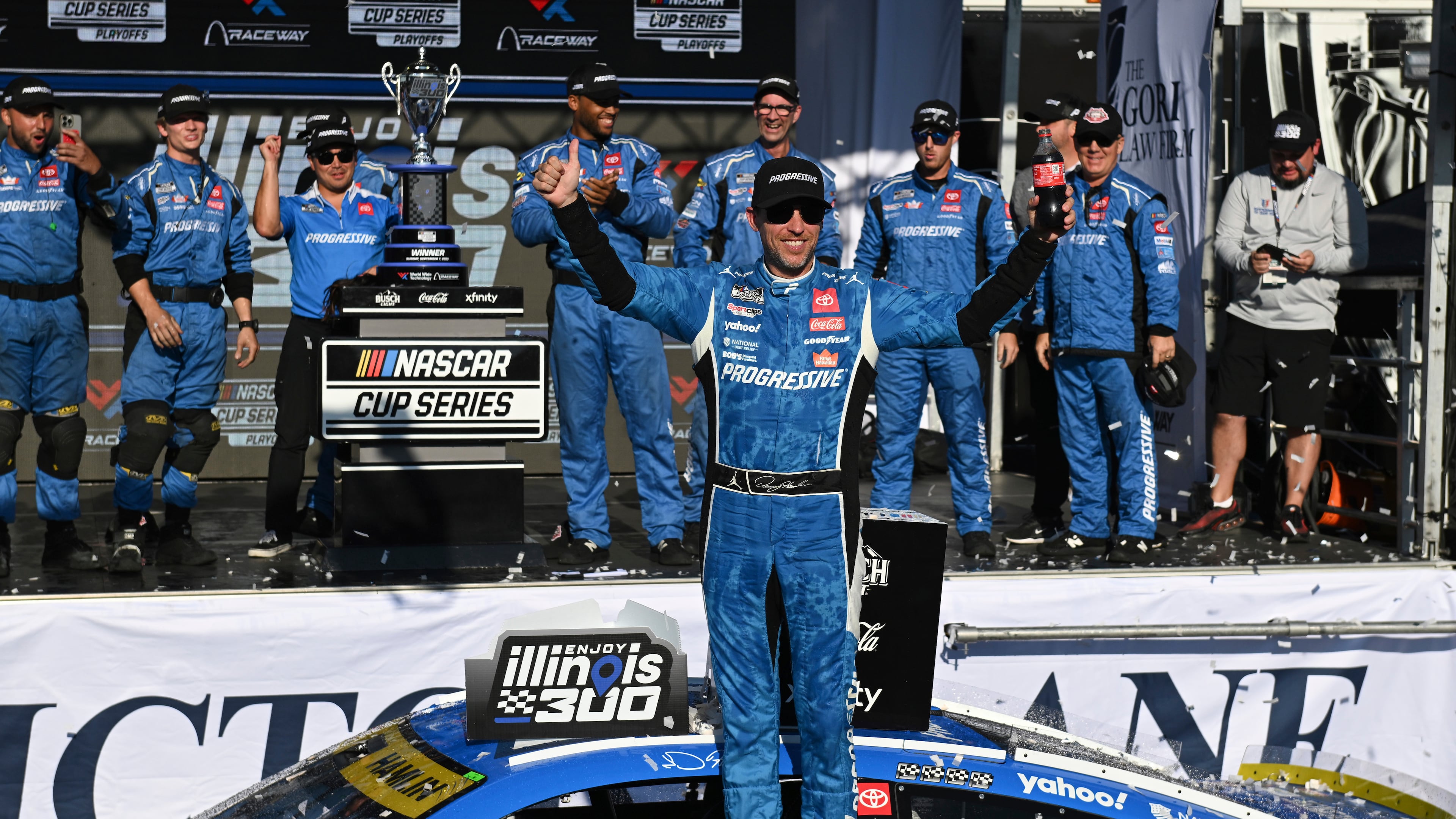 Denny Hamlin, center, celebrates after winning a NASCAR Cup Series auto race at World Wide Technology Raceway, Sunday, Sept. 7, 2025, in Madison, Ill. (AP Photo/Connor Hamilton)