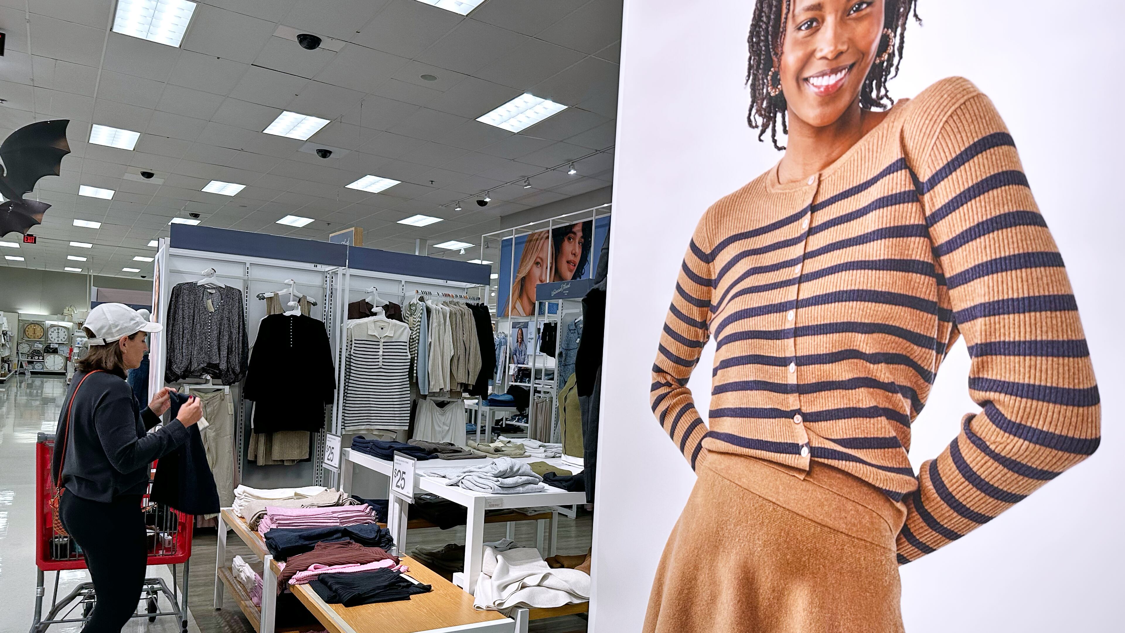 FILE - A shopper shops at a retail store in Arlington Heights, Ill., Tuesday, Sept. 23, 2025. (AP Photo/Nam Y. Huh, File)