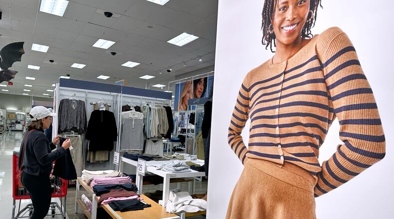 FILE - A shopper shops at a retail store in Arlington Heights, Ill., Tuesday, Sept. 23, 2025. (AP Photo/Nam Y. Huh, File)