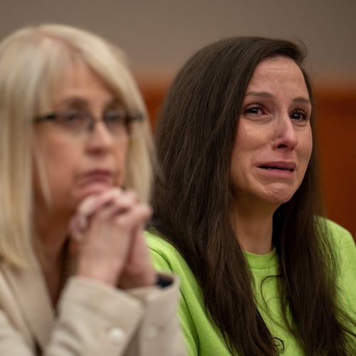 Kouri Richins, right, reacts as her brother, Ronney Darden, speaks on her behalf during her sentencing in 3rd District Court in Park City, Utah, Wednesday, May 13, 2026. (Trent Nelson/The Salt Lake Tribune via AP, Pool)