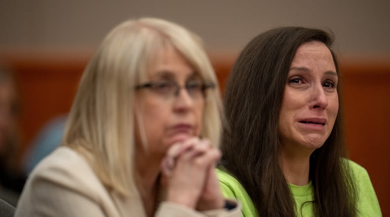 Kouri Richins, right, reacts as her brother, Ronney Darden, speaks on her behalf during her sentencing in 3rd District Court in Park City, Utah, Wednesday, May 13, 2026. (Trent Nelson/The Salt Lake Tribune via AP, Pool)