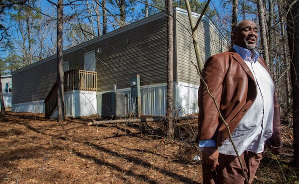  Peter Byrd stands in the front yard of his Douglasville home Friday, February 11, 2022. STEVE SCHAEFER FOR THE ATLANTA JOURNAL-CONSTITUTION. 