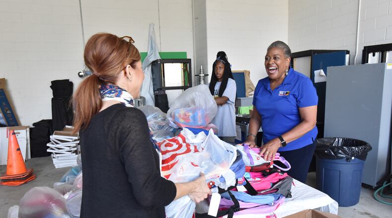 July 21, 2018  - WSB-TV's Jocelyn Dorsey greets Laura Beasley (left) with Hiscox Insurance as she brings donations during WSB's Stuff the Bus event at the WSB Television and Radio on Saturday, July 21, 2018. An in-depth profile that chronicles the 45-year career of WSB's Joselyn Dorsey, who is retiring on August 3, 2018. WSB-TV and Childrenâs Restoration Network help to homeless children and kids in group homes for the school year. HYOSUB SHIN / HSHIN@AJC.COM
